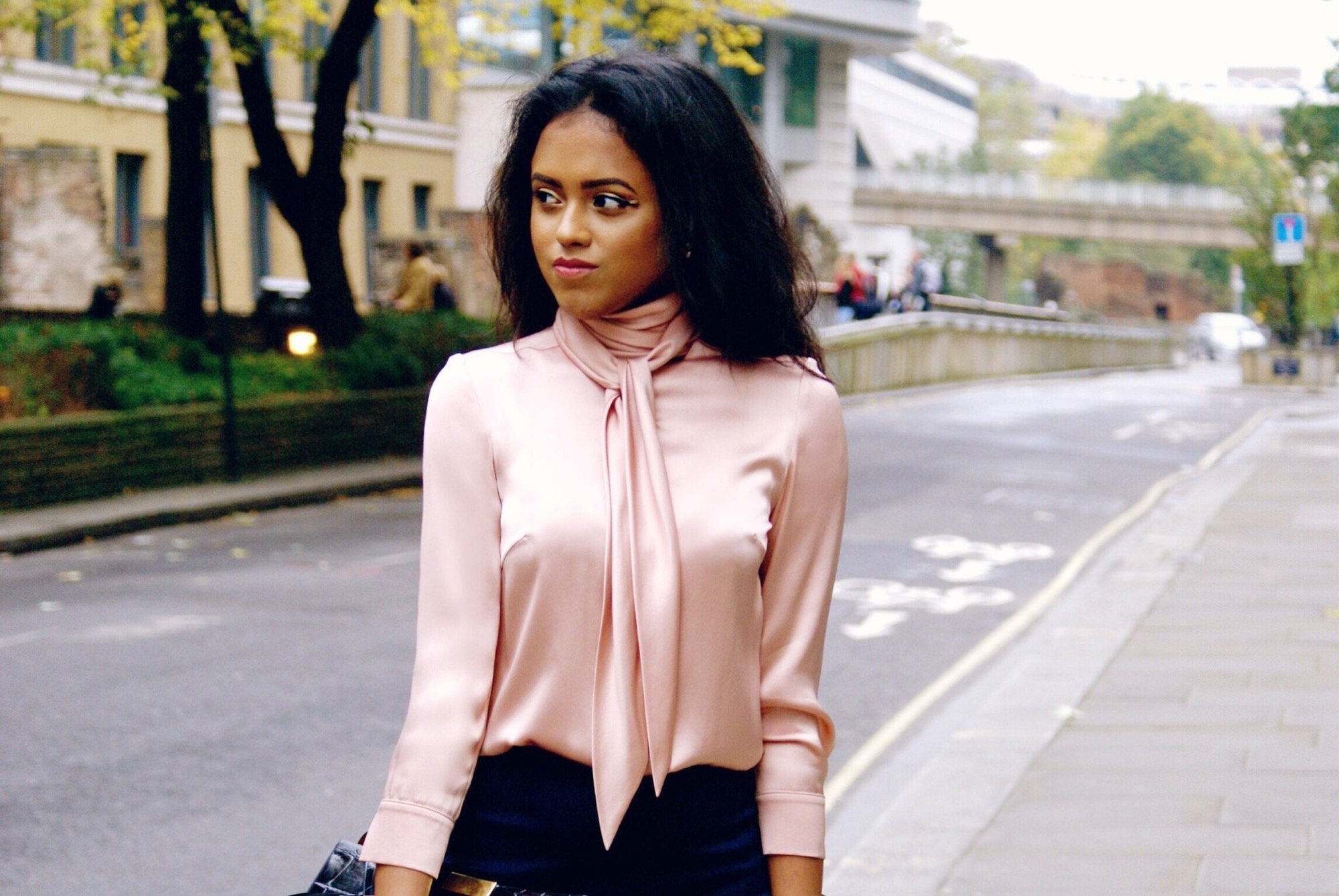 Sachini wearing a pink blouse