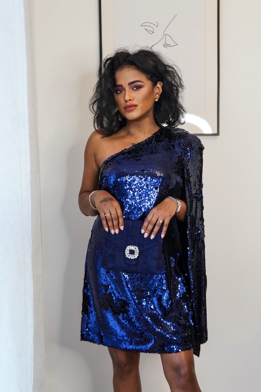 Sachini wearing a Reiss blue sequin dress