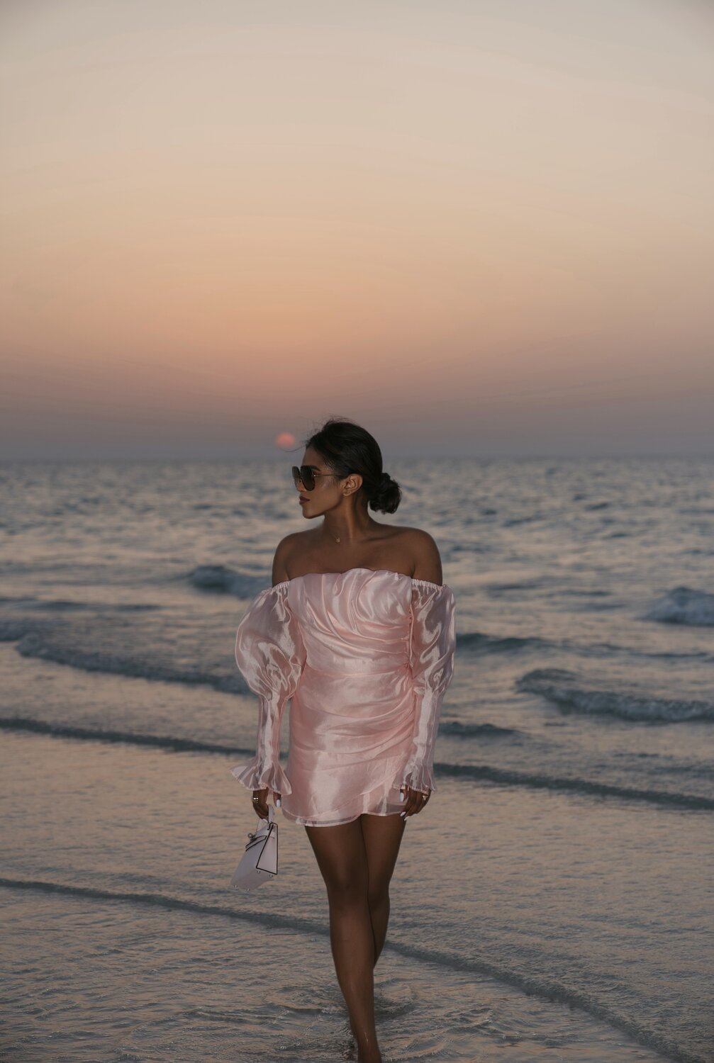 Sachini Dilanka wearing a pink dress in Dubai beach