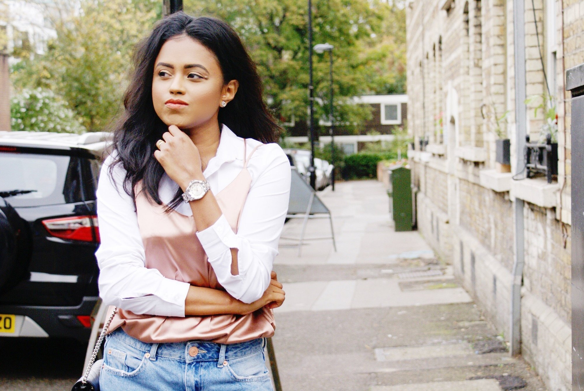 Sachini wearing a pink silk cami