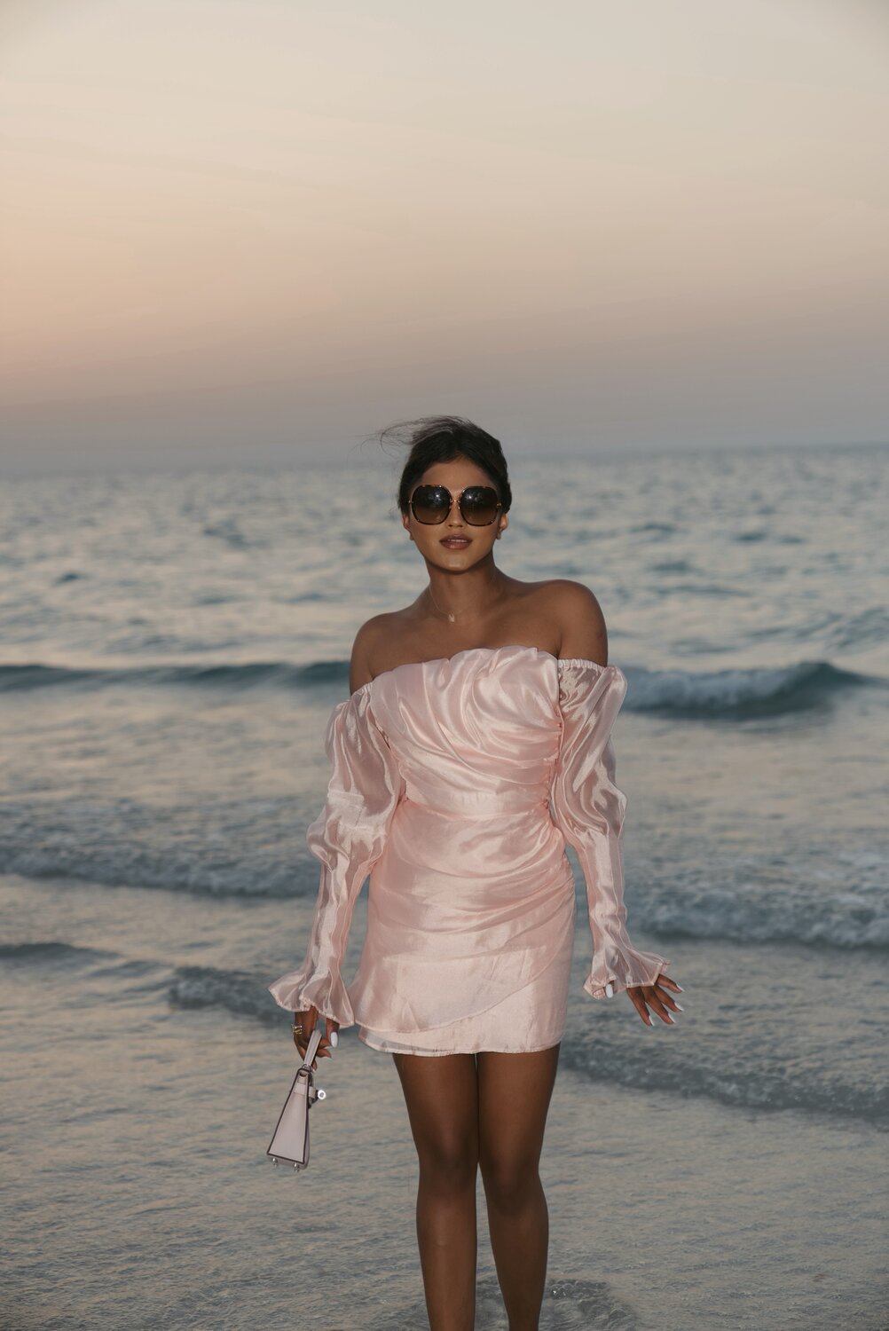 Sachini Dilanka wearing a pink dress in Dubai beach