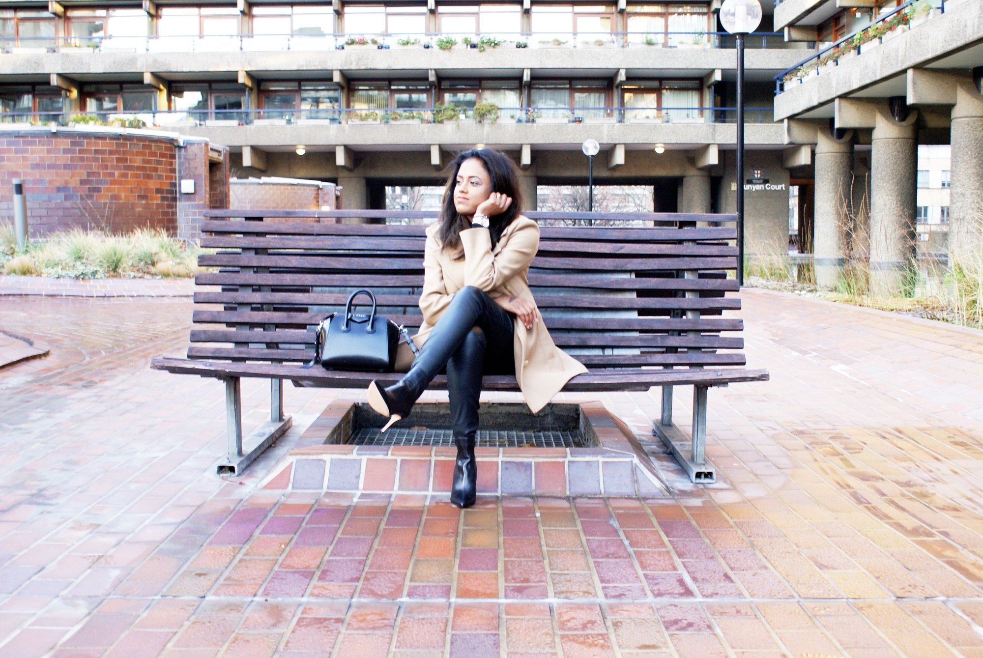 Sachini sitting on a bench