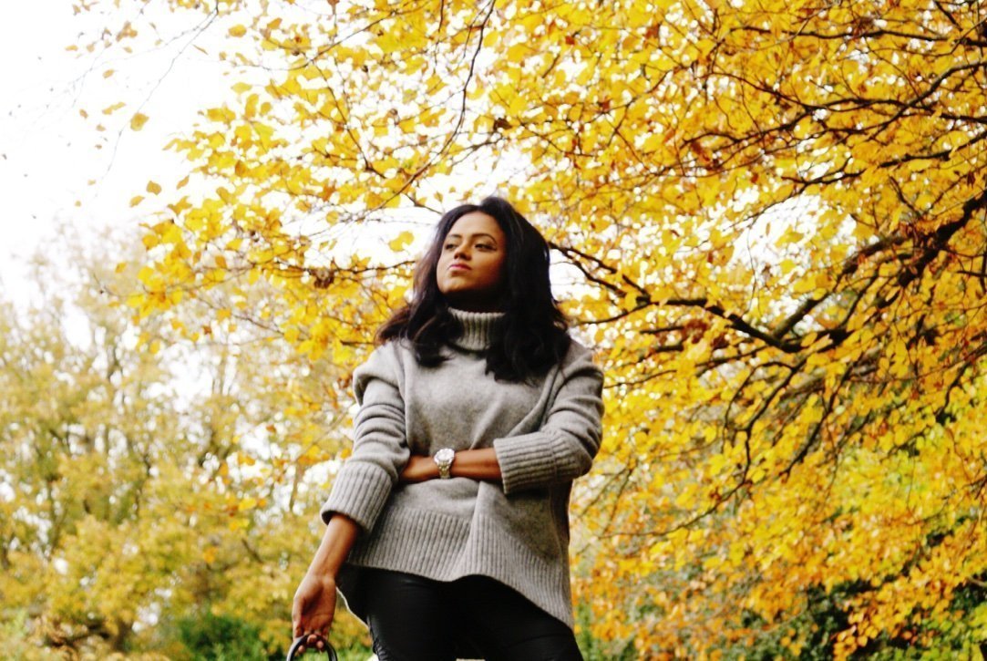 Sachini outside wearing grey knitwear