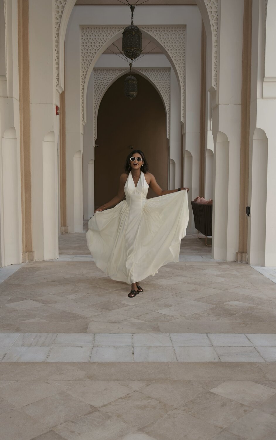 Sachini Dilanka wearing a white dress