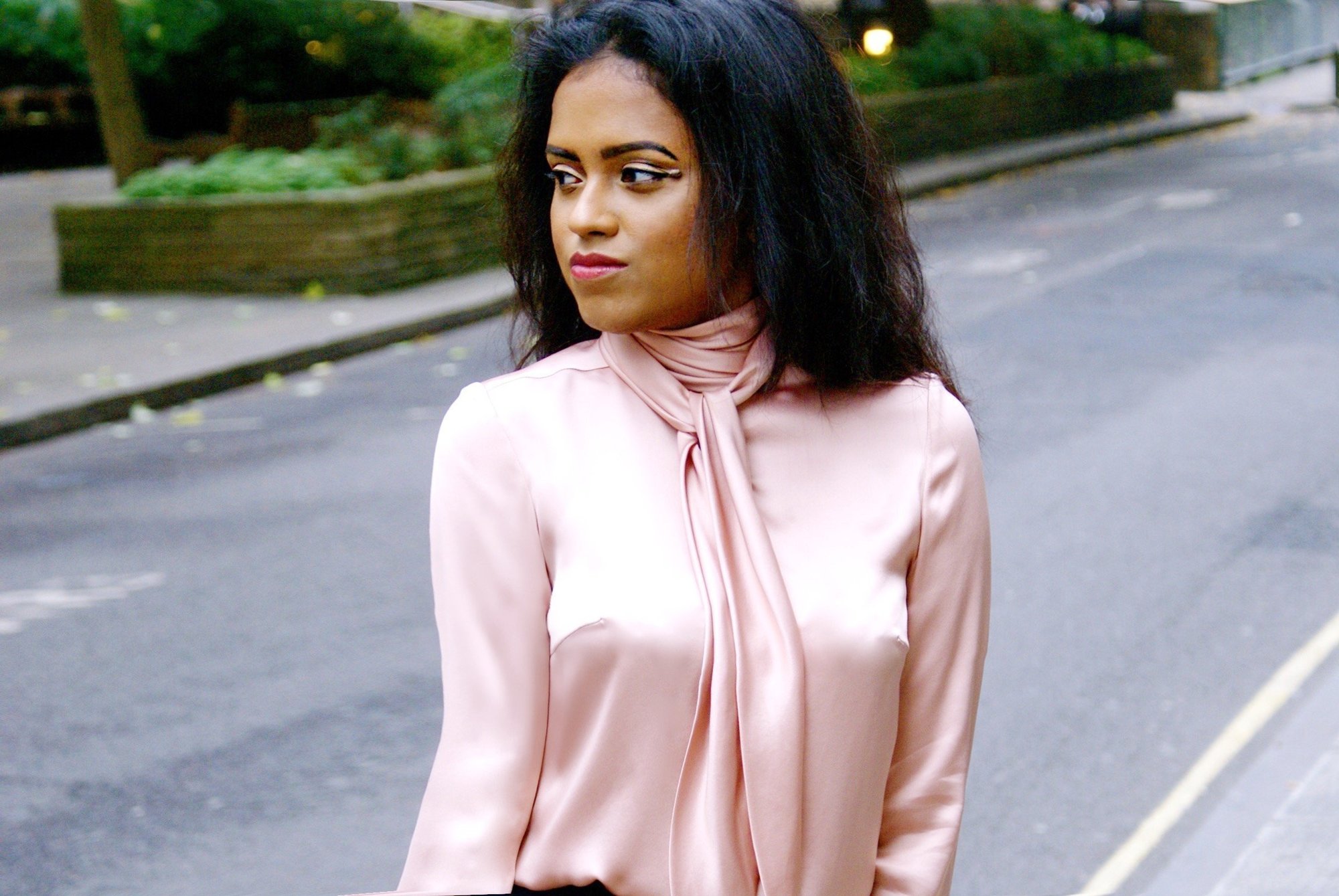 Sachini wearing a pink top