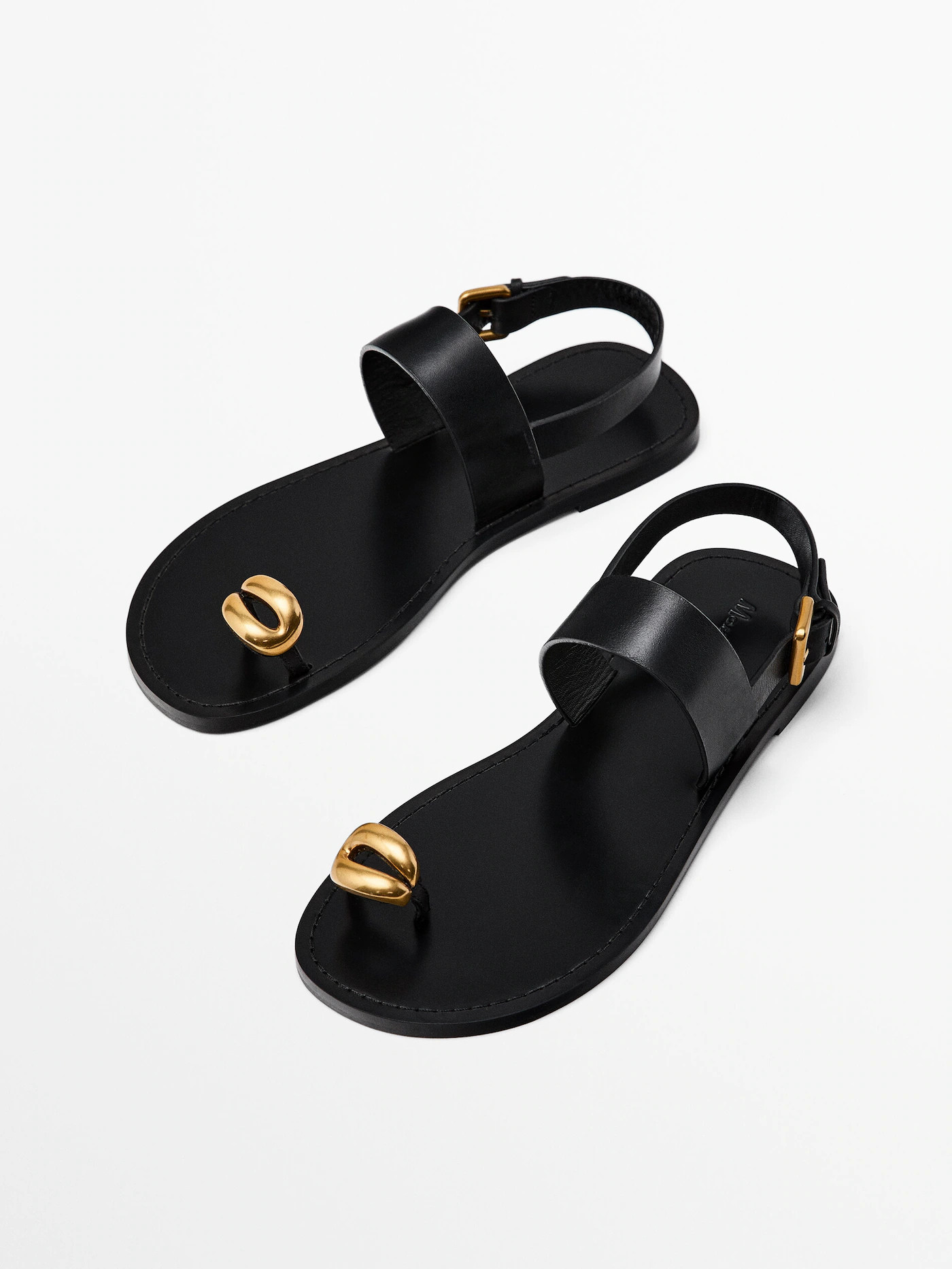 Flat sandals with metallic embellishment